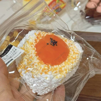 🍙 Duck Egg Rice Ball Sushi Taba Squishy – Silicone Spoiled Egg Rice Roll Stress Relief Toy